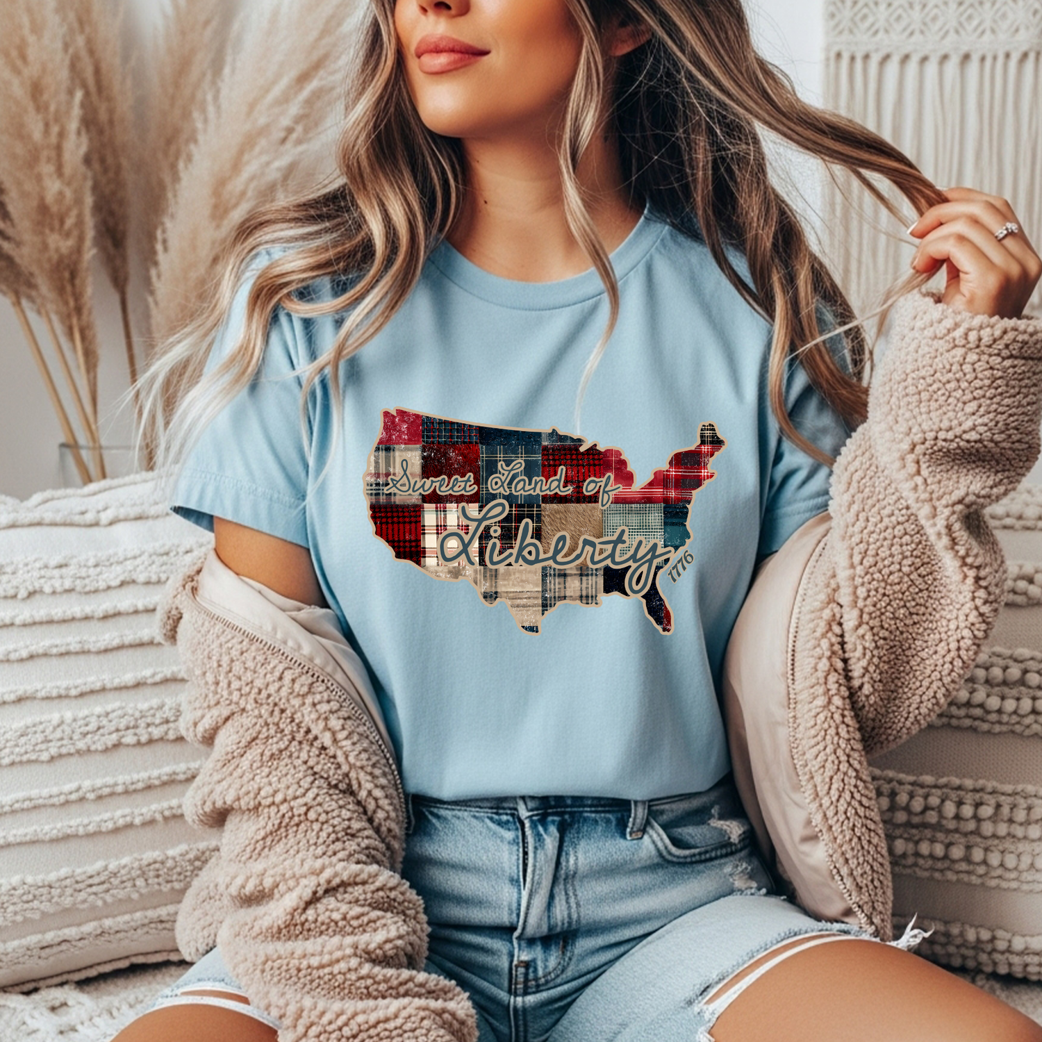 Light blue tee with a quilted map of America and the text 'Sweet Land of Liberty"