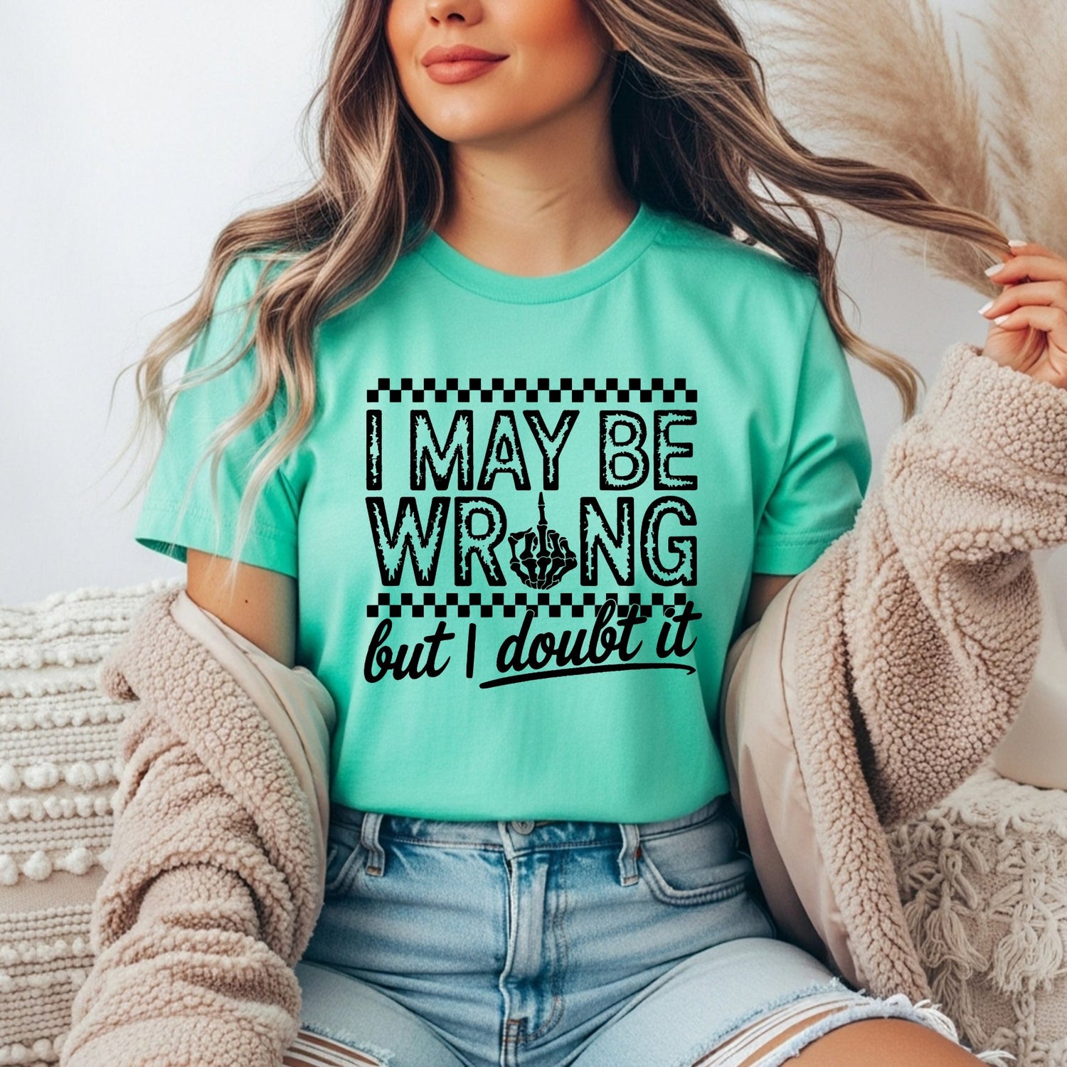 teal shirt that says I may be wrong but I doubt it