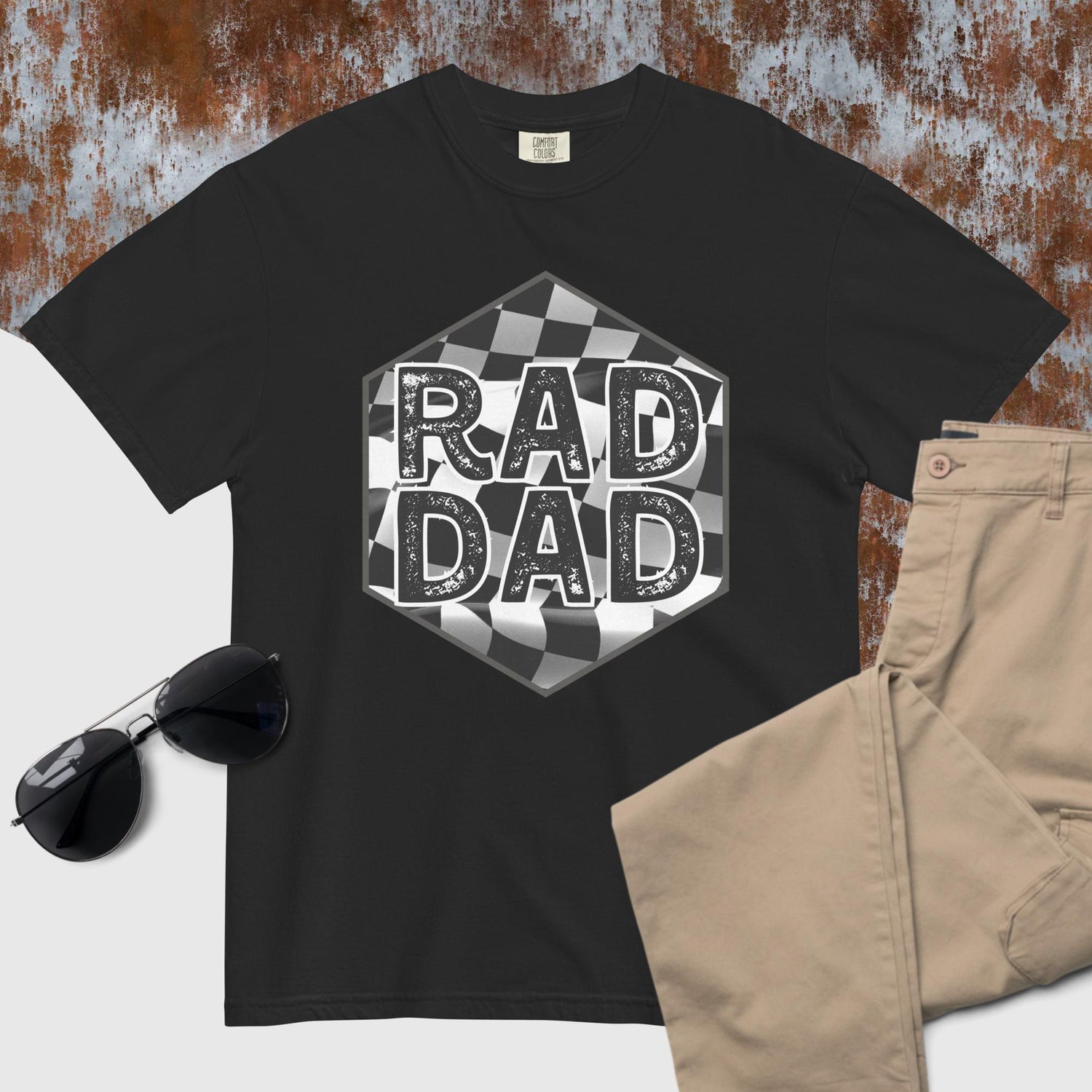 black tee that says rad dad laid over a checkered flag 